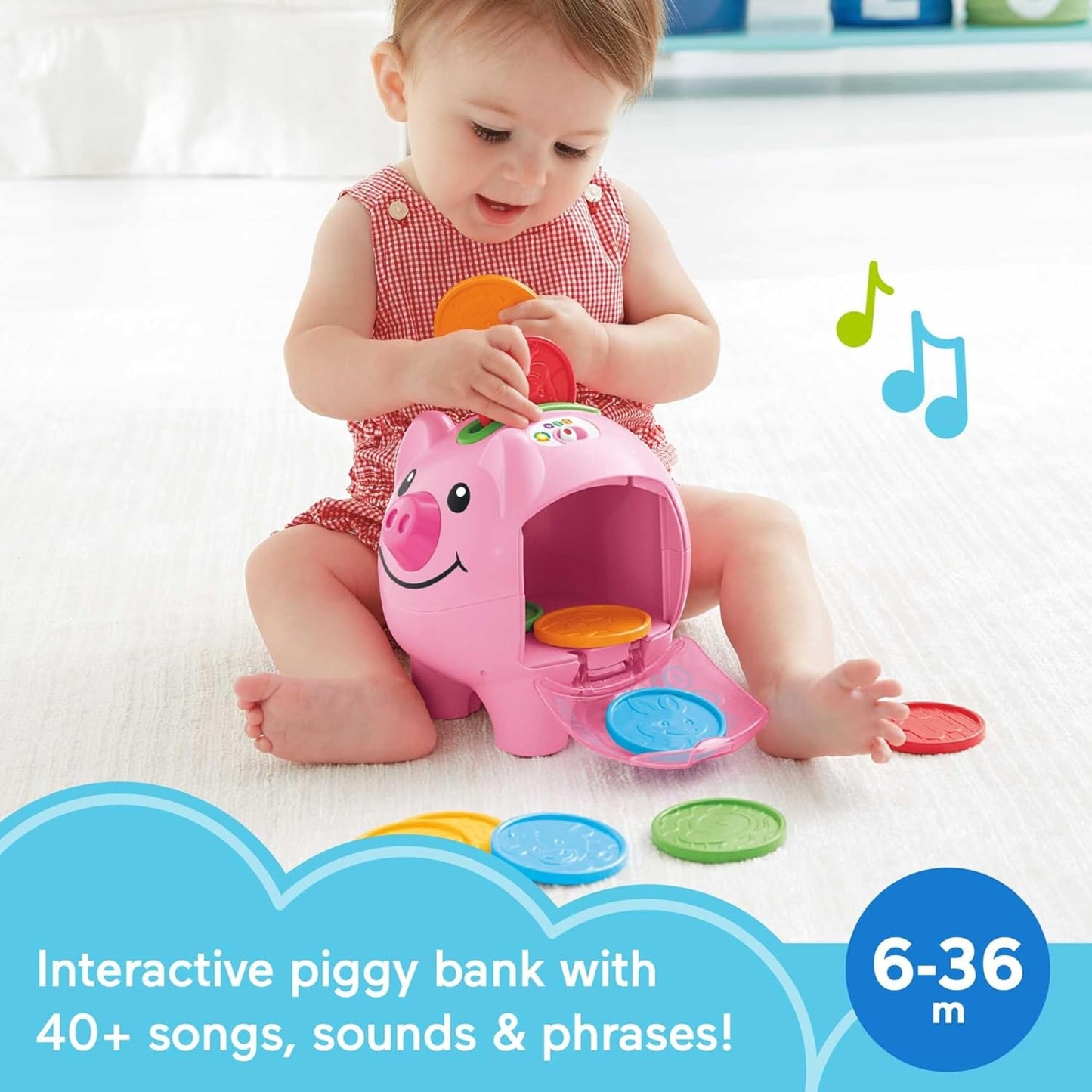Baby playing with Fisher-Price Smart Stages piggy bank toy featuring colorful coins and interactive sounds.