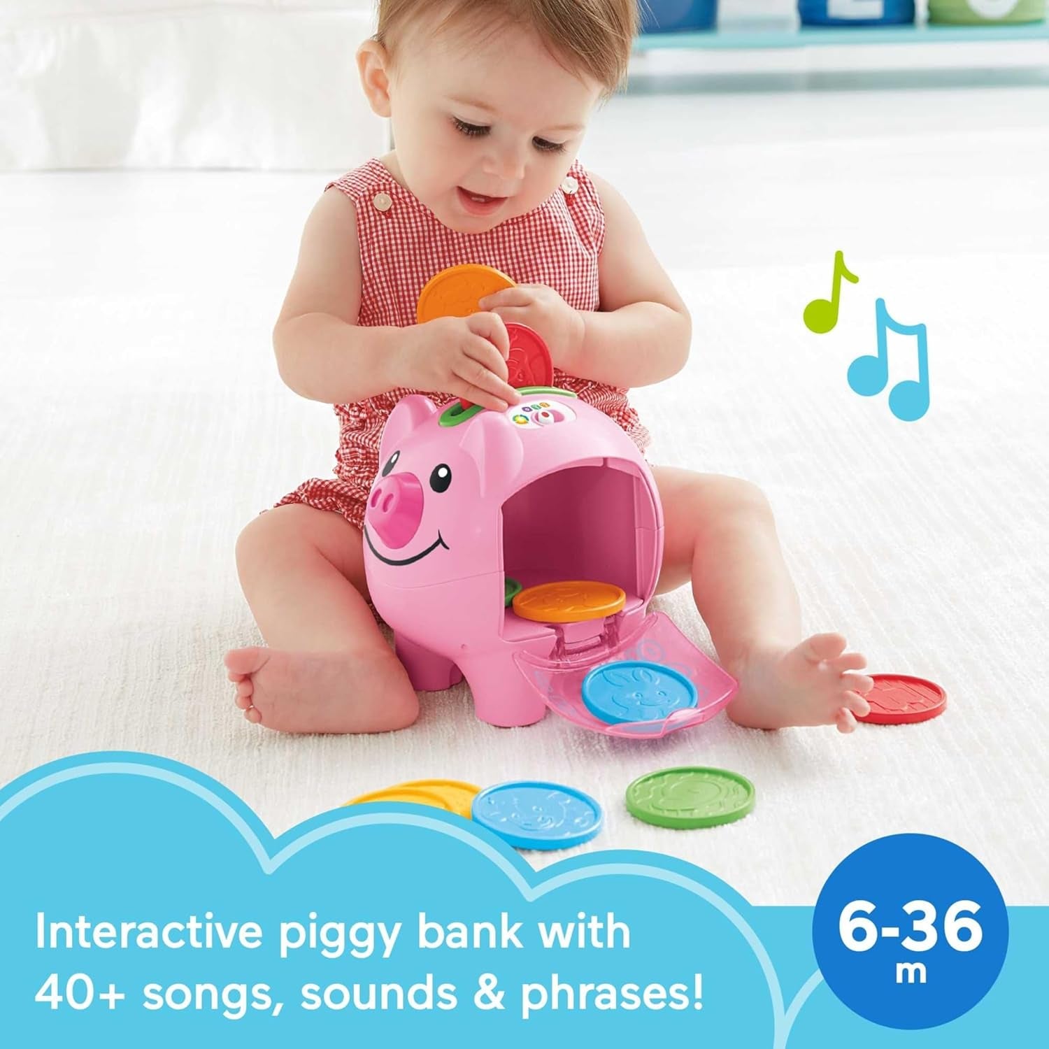 Baby playing with Fisher-Price Smart Stages piggy bank toy featuring colorful coins and interactive sounds.