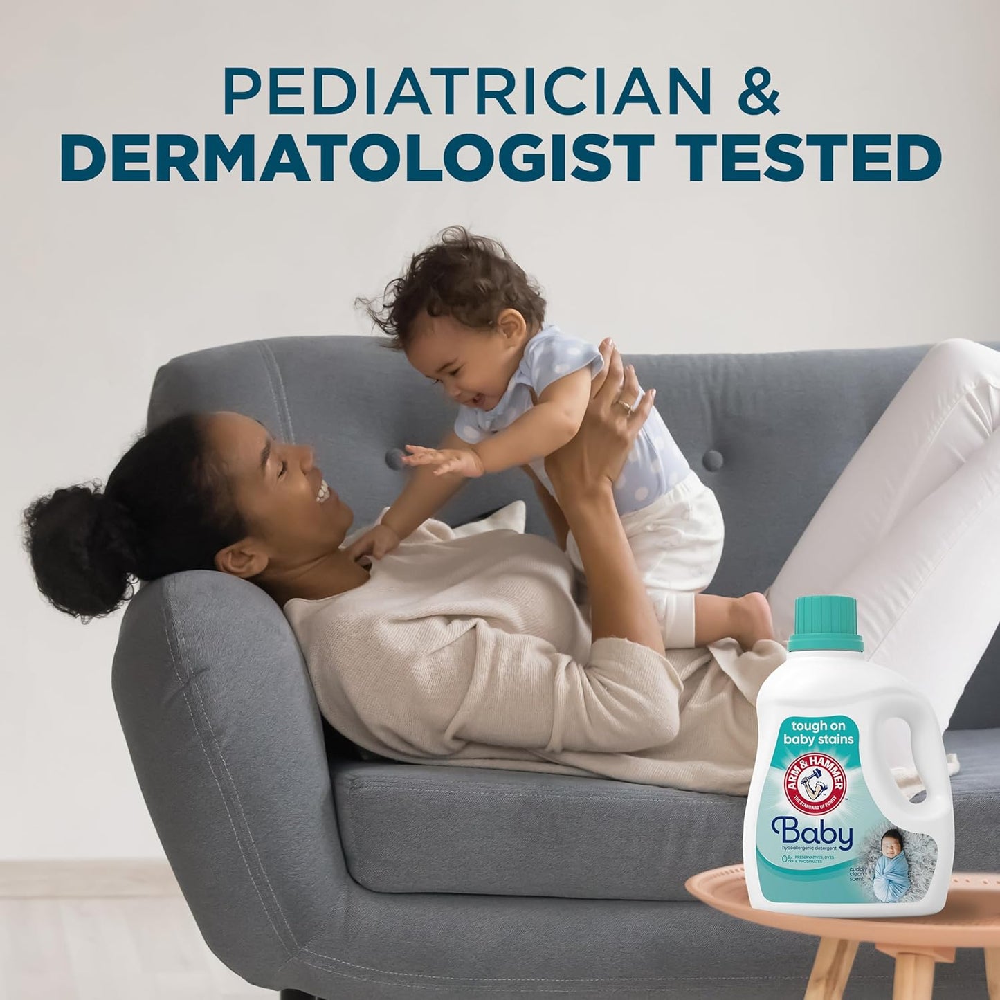 Mother playing with baby, featuring hypoallergenic baby laundry detergent for gentle cleaning.