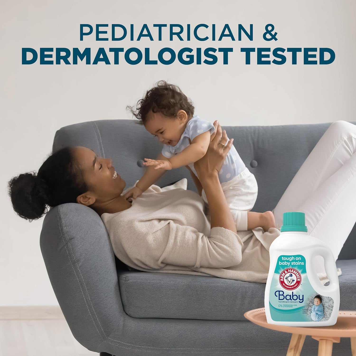 Mother playing with baby, featuring hypoallergenic baby laundry detergent for gentle cleaning.