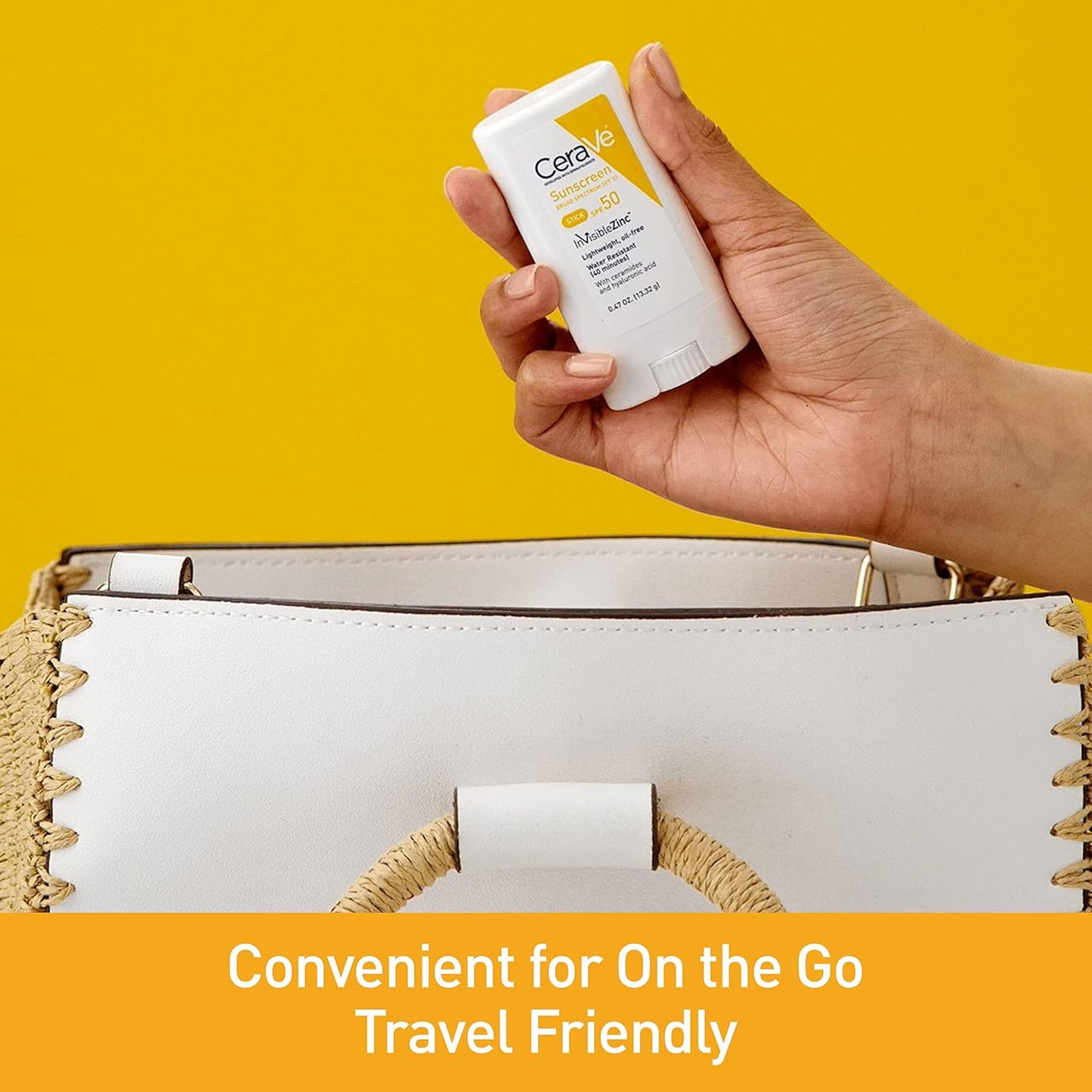 CeraVe mineral sunscreen stick SPF 50 held in hand above a stylish bag, ideal for travel and on-the-go protection.
