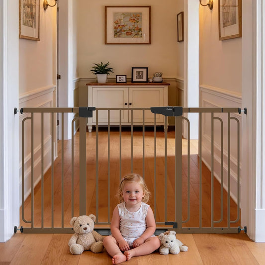 Extra wide baby gate for stairs installed in a home hallway with a girl and teddy bears.