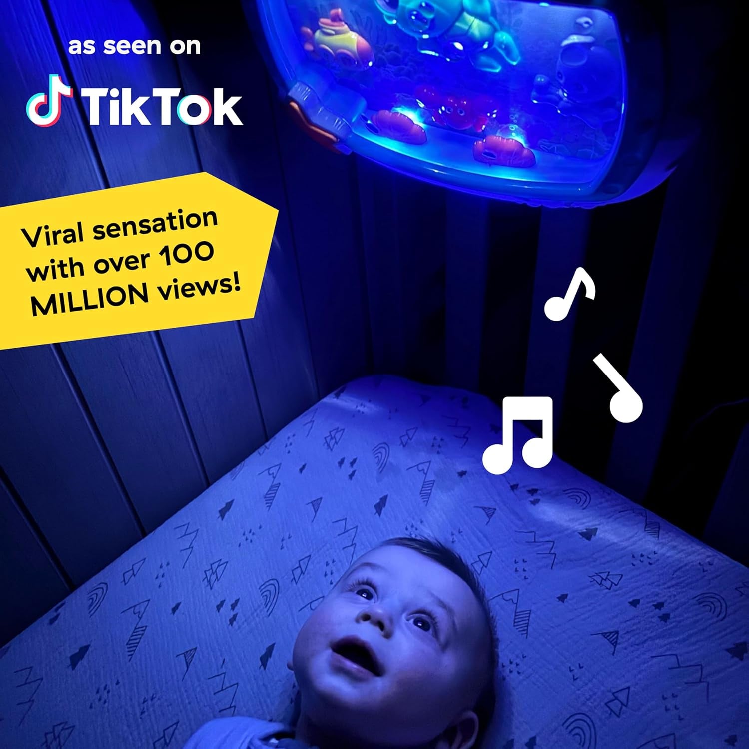 Baby Einstein crib soother with soothing lights and music, captivating newborn in crib at night.