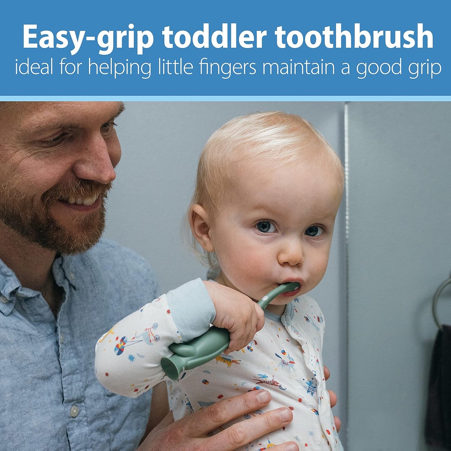 Baby using a dinosaur toddler toothbrush 2-pack with easy-grip design for little fingers.