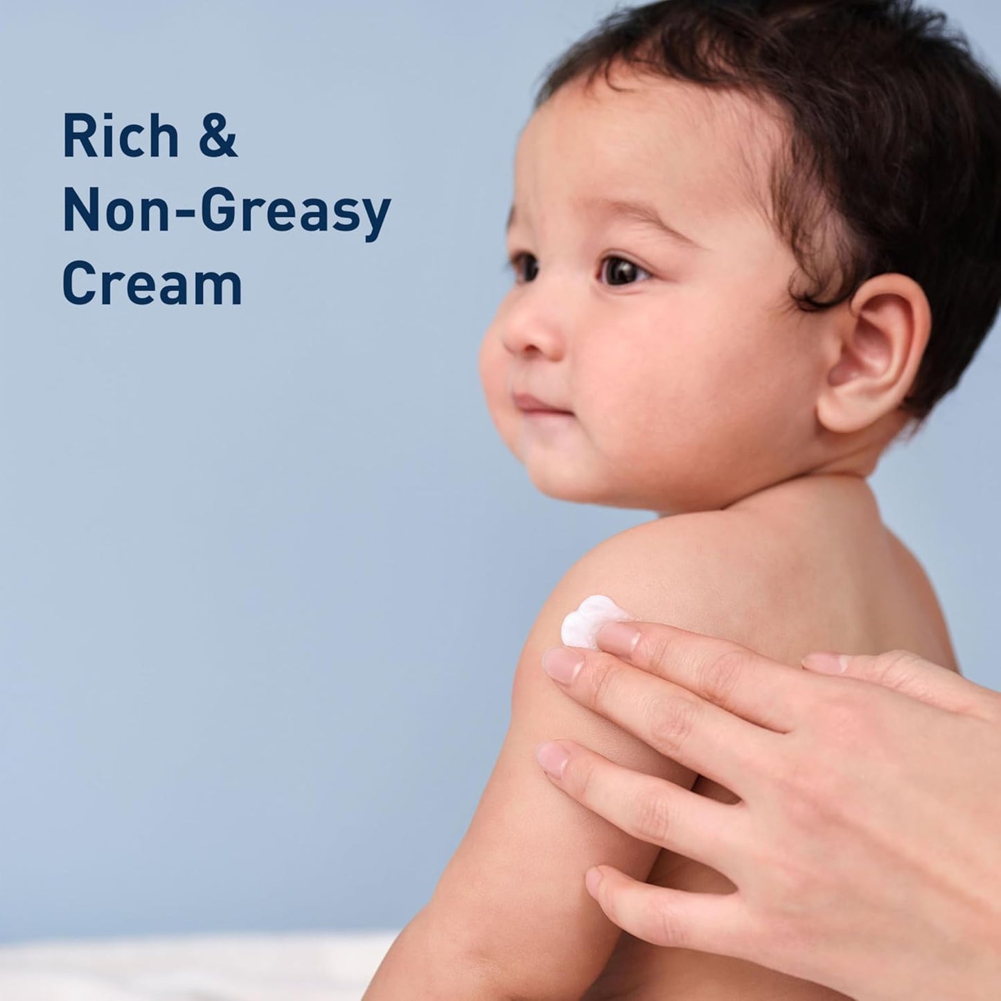 Gentle baby moisturizing cream applied to a baby's shoulder for hydration and skin barrier care.