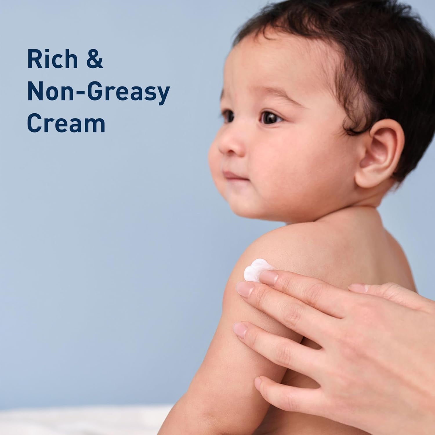 Gentle baby moisturizing cream applied to a baby's shoulder for hydration and skin barrier care.